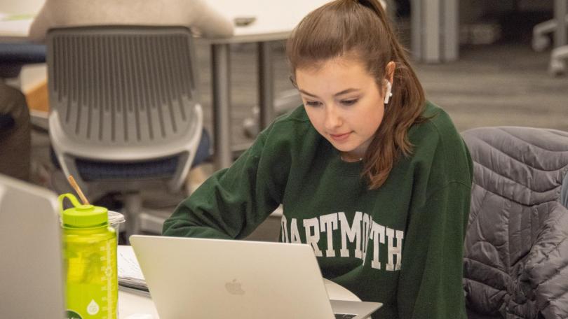 Dartmouth student studying in the library