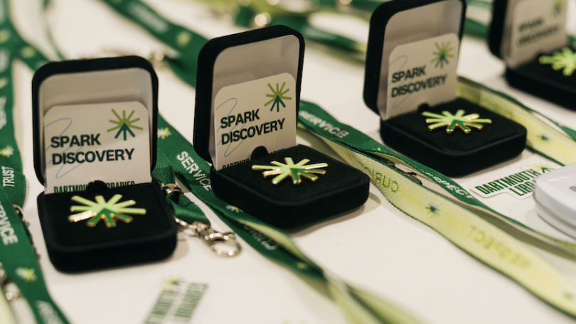 spark discovery pins in light and dark green