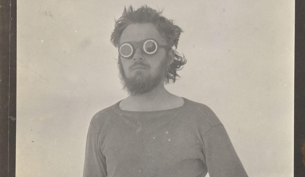 black and white photo of E Lorne Knight on Wrangel Island wearing goggles