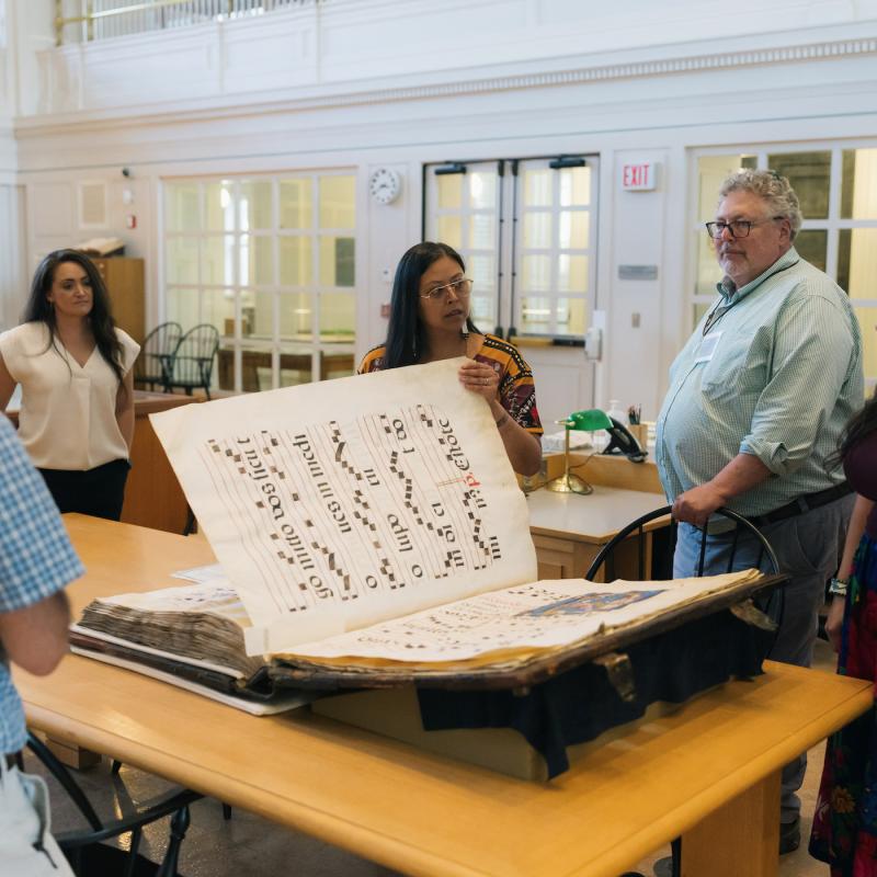Library workshop with large manuscript